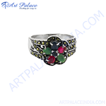 Load image into Gallery viewer, Sterling silver ring with a flower design featuring red and green gemstones and marcasite detailing
