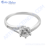 Load image into Gallery viewer, Silver solitaire engagement ring with a large, round cubic zirconia center stone. The band is set with smaller cubic zirconia stones.

