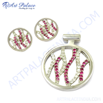 Load image into Gallery viewer, Sterling silver stud earrings and pendant set with round ruby gemstones and silver detailing
