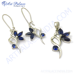 Load image into Gallery viewer, Sterling silver earring and pendant set with blue sapphire gemstones in a flower design.
