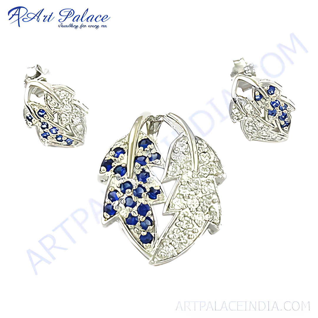 Sterling silver leaf pendant and stud earrings set with blue sapphire gemstones.