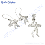 Load image into Gallery viewer, 925 sterling silver bow earrings and pendant set with detailed design.
