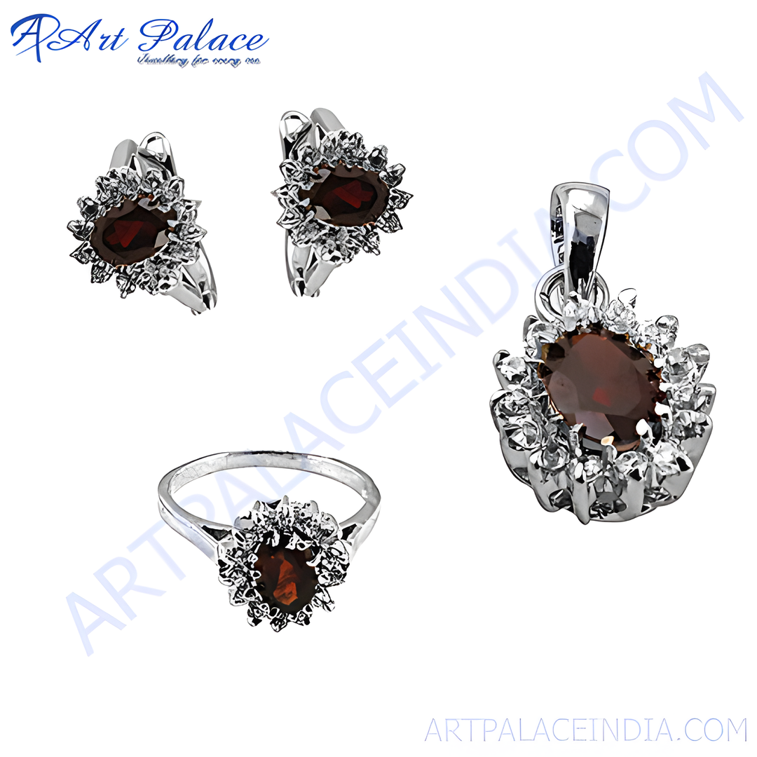 Sterling silver jewelry set with red garnet gemstones. Includes earrings, ring and pendant.