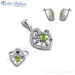Load image into Gallery viewer, Sterling silver peridot jewelry set: pendant, earrings, and ring with green gemstones.
