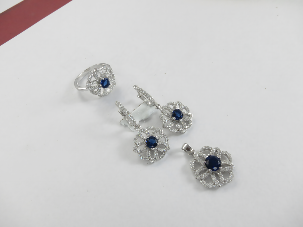 925 sterling silver jewelry set featuring blue sapphire gemstones: ring, earrings, and pendant