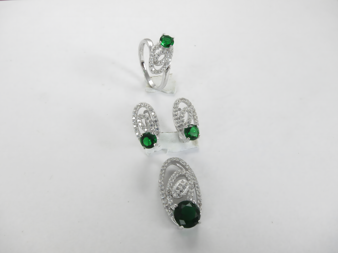 Sterling silver ring and earrings set featuring emerald green gemstones, a perfect jewelry gift.