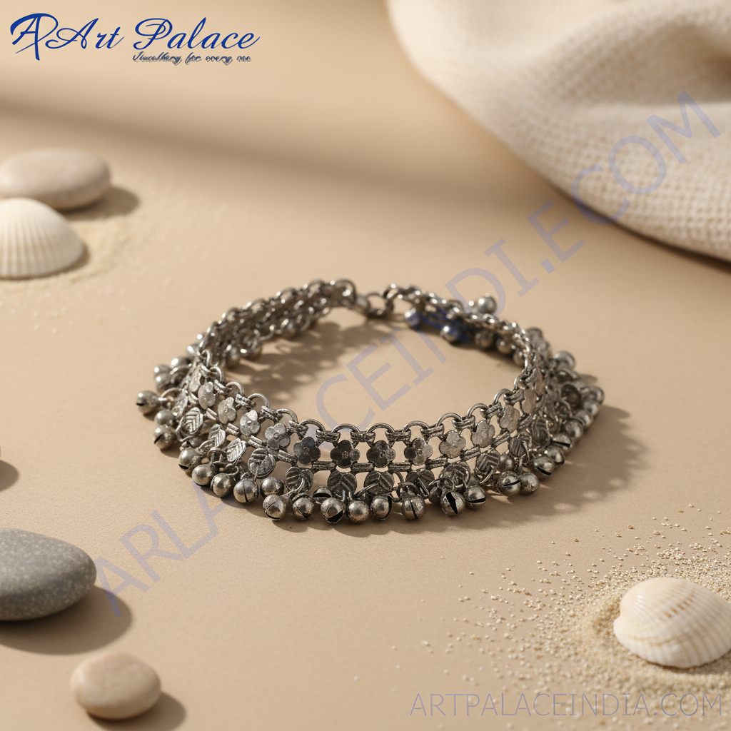 Silver anklet with dangling bells, perfect for adding a touch of bohemian style to your outfit