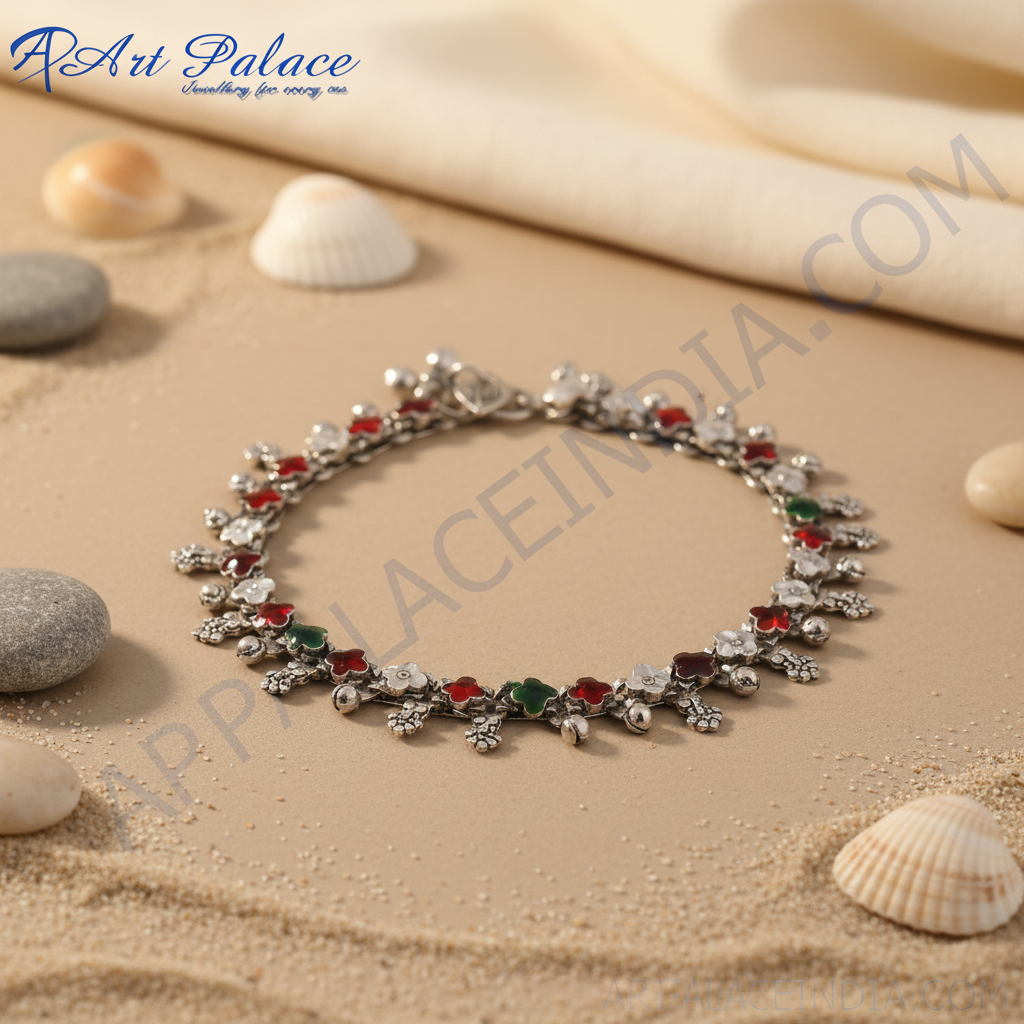 925 sterling silver anklet with red, green and white enamel flower accents on a white background.