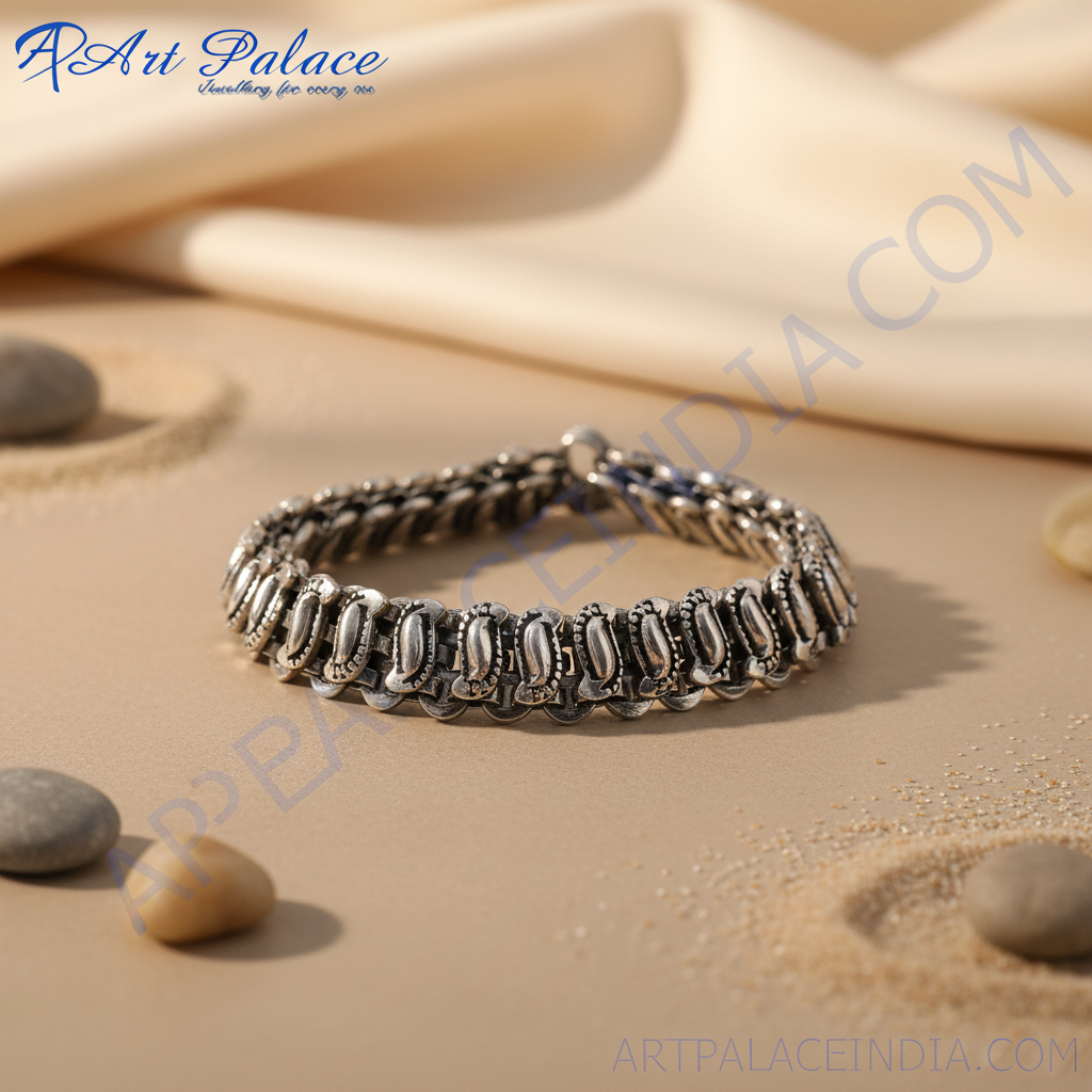 Sterling silver anklet featuring a detailed, ornate chain design