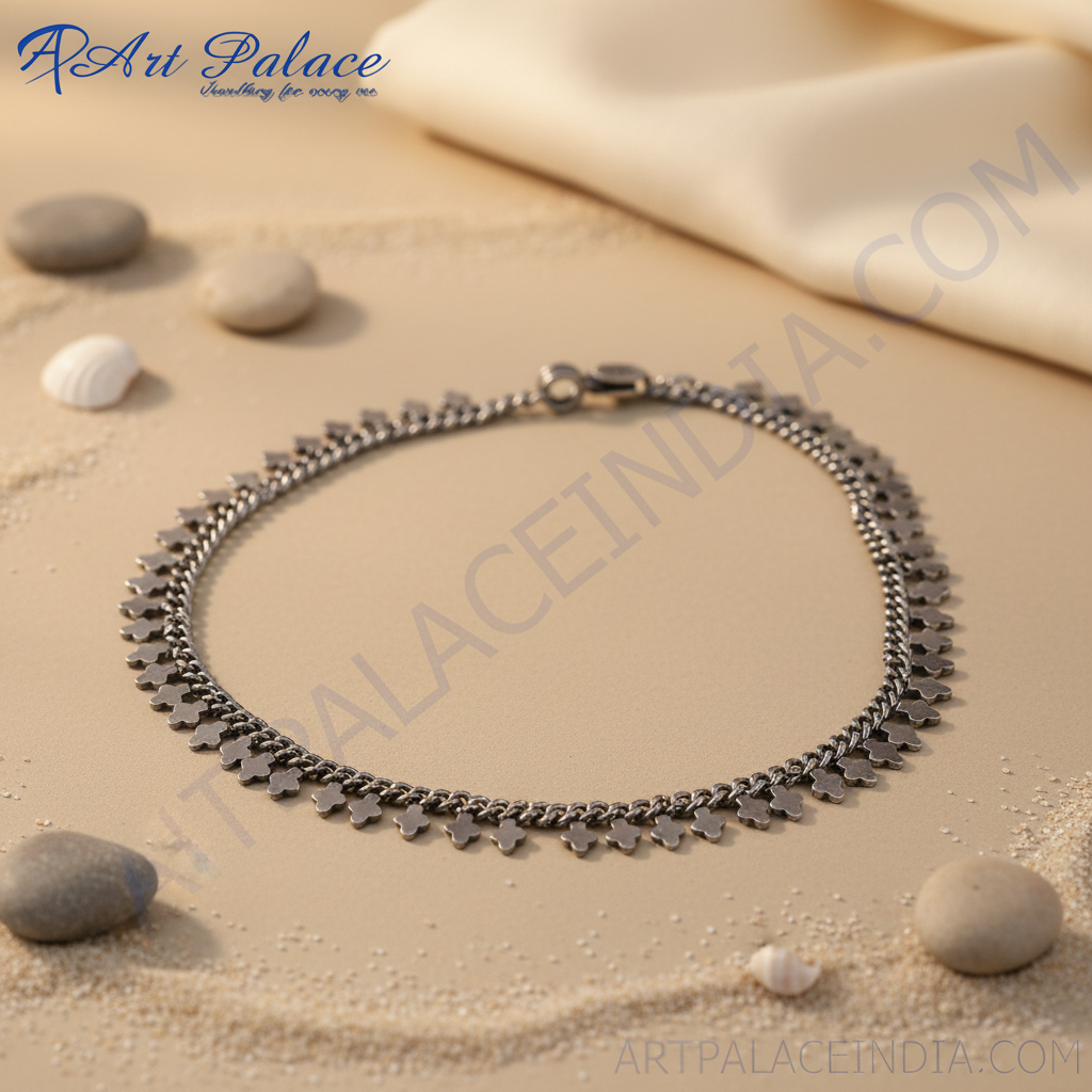 Sterling silver chain anklet with clover charms on a white background, perfect for everyday wear