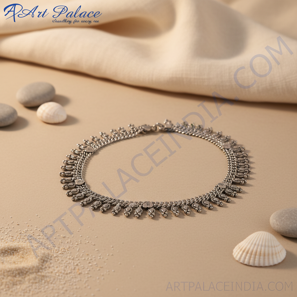 Sterling silver anklet featuring teardrop charms, perfect for women