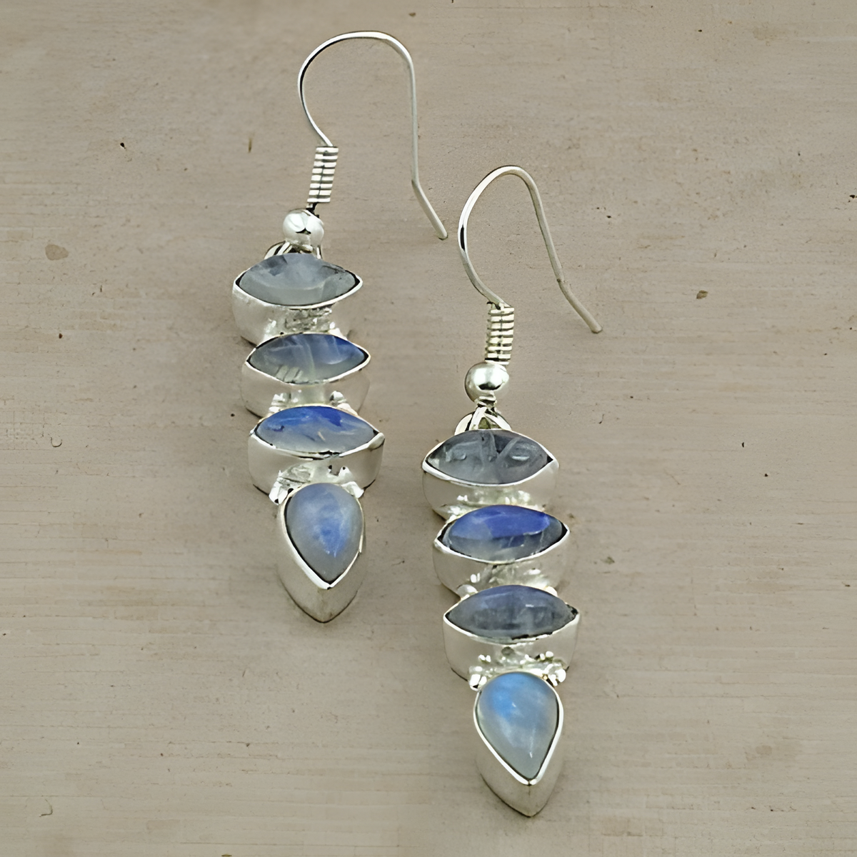 Sterling silver dangle earrings featuring multiple blue moonstone gemstones