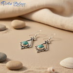 Load image into Gallery viewer, 925 sterling silver dangle earrings with a round turquoise gemstone. Features a decorative design.
