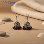 Load image into Gallery viewer, Silver jhumka earrings with ornate design and dangling red beads for women
