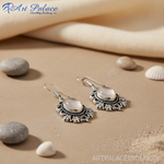 Load image into Gallery viewer, 925 sterling silver dangle earrings with oval moonstone gemstones and intricate design
