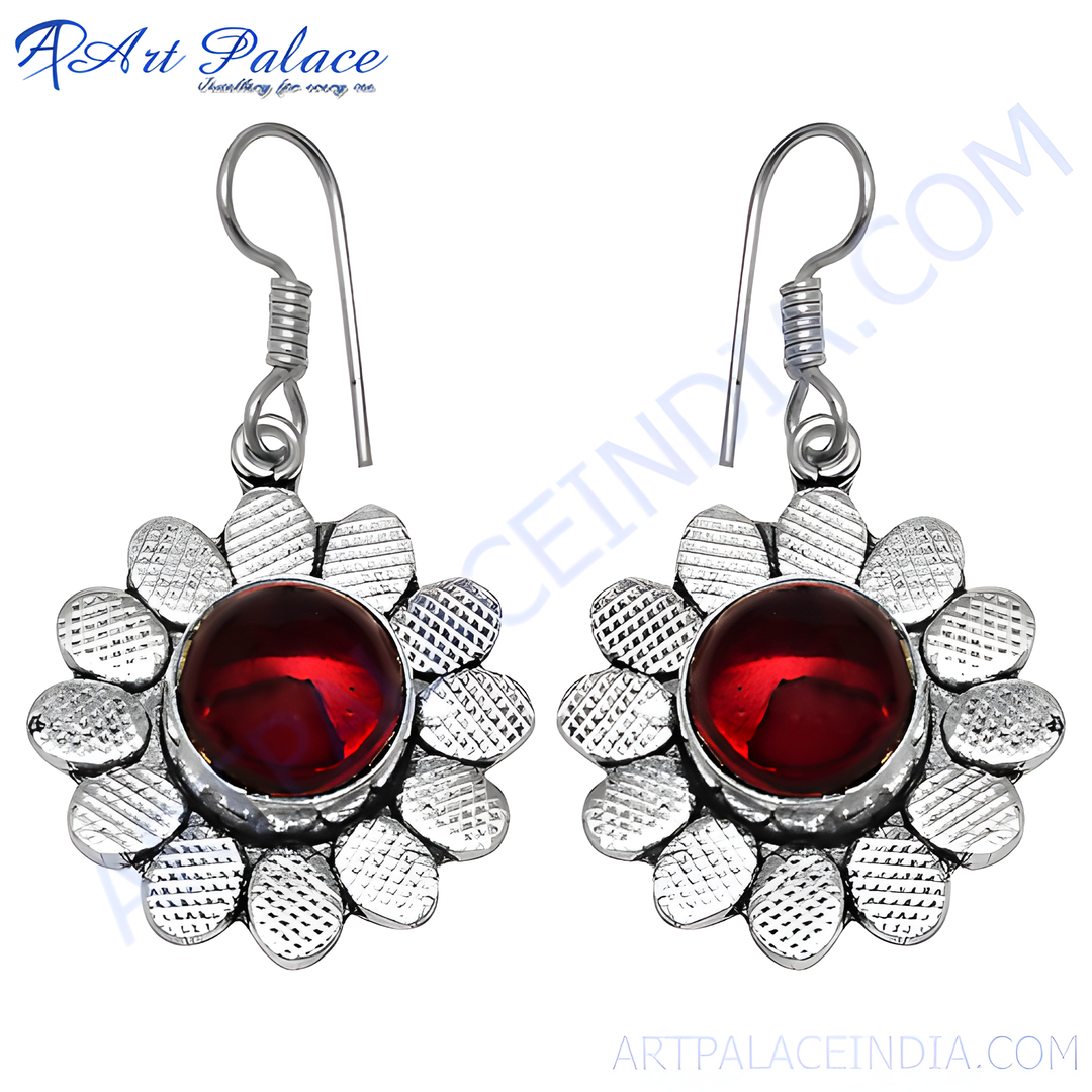 925 sterling silver dangle earrings with a red gemstone center in a flower design.