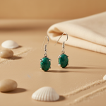 Load image into Gallery viewer, 925 sterling silver drop earrings with oval turquoise gemstone.
