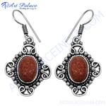 Load image into Gallery viewer, 925 sterling silver dangle earrings featuring oval sunstone gemstones in a detailed setting.
