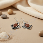 Load image into Gallery viewer, 925 sterling silver dangle earrings featuring oval sunstone gemstones in a detailed setting.
