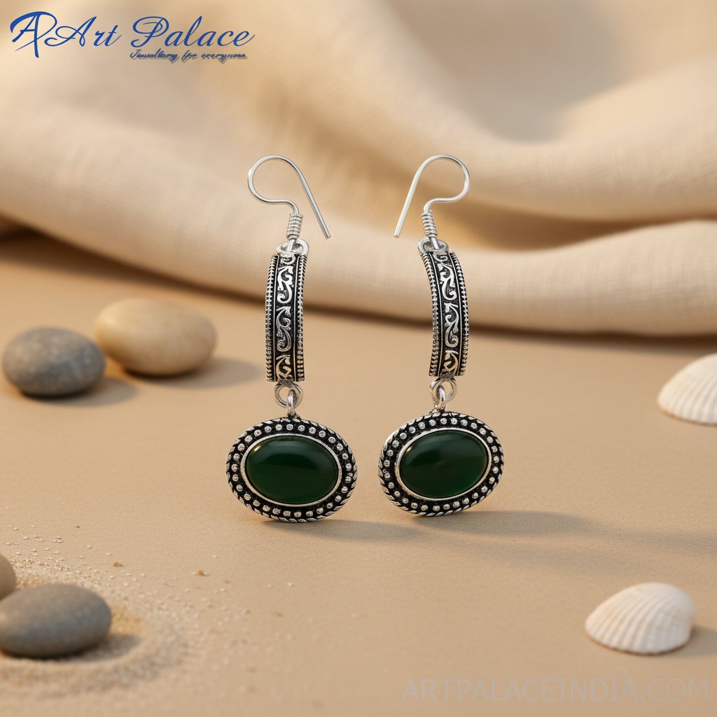 Sterling silver drop earrings featuring oval green onyx gemstones, perfect for any occasion.