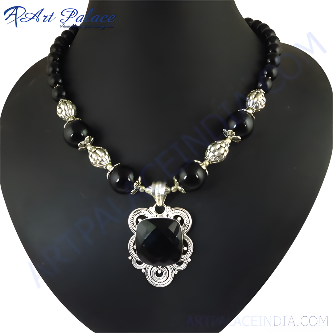 Black onyx bead necklace with a silver pendant, featuring a square-cut black stone.