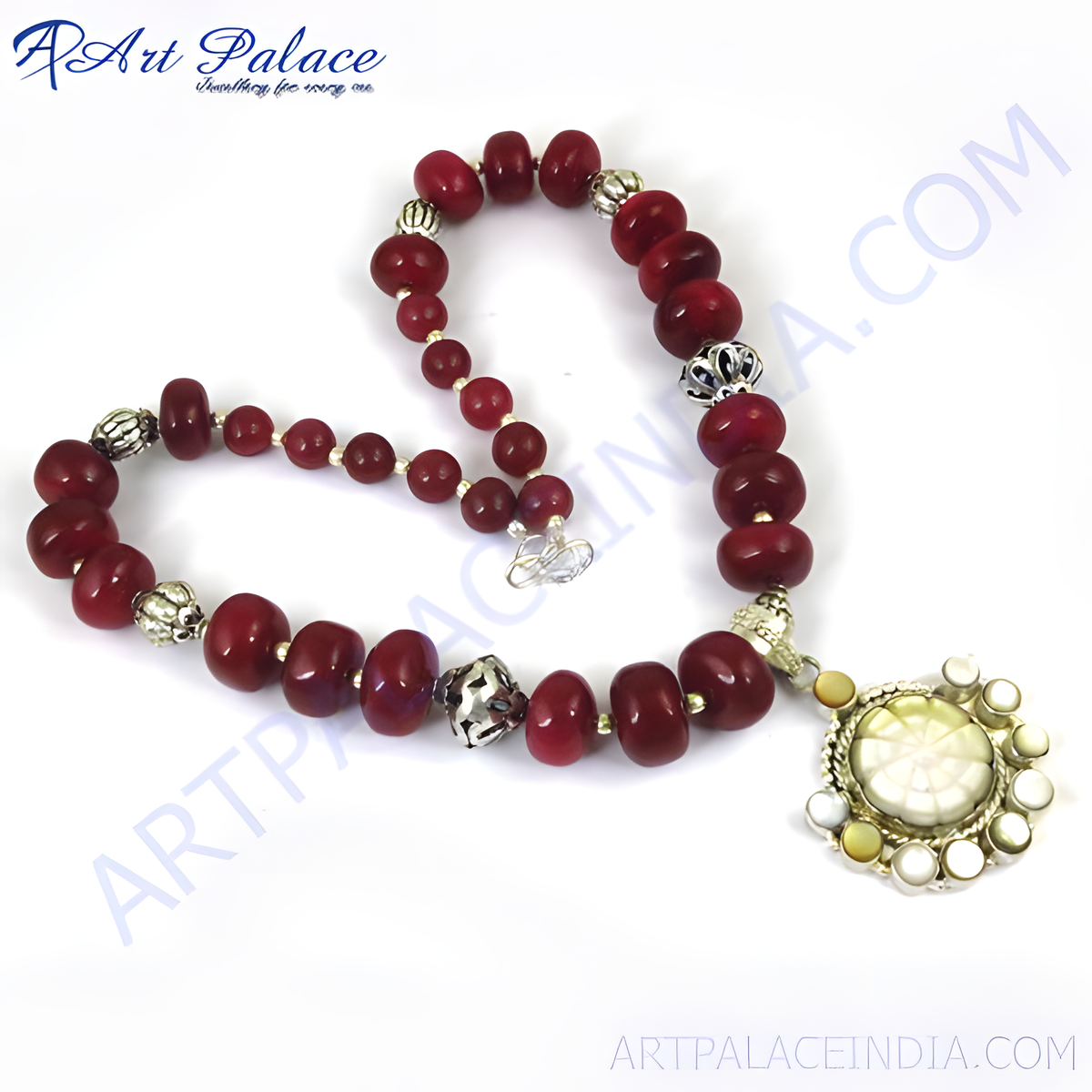 Red stone bead necklace with a silver pendant, perfect for adding a touch of elegance to any outfit