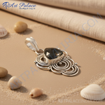 Load image into Gallery viewer, Sterling silver labradorite pendant with a teardrop-shaped gemstone in a detailed silver setting.
